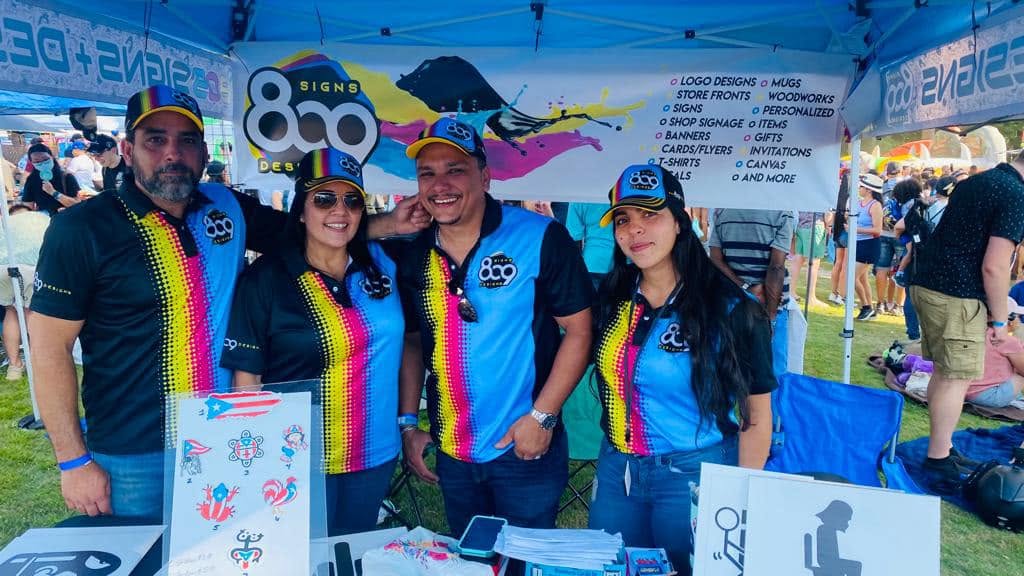 The 809 Signs and Designs team at a community event in Fayetteville